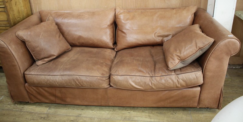 A Heals brown leather sofa, W.220cm D.94cm H.72cm